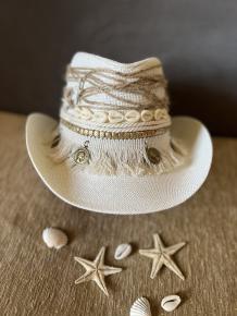 Sea shells off white cowboy hat